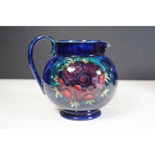 65 - Collection of Moorcroft ceramics to include 2 x Anemone jugs on blue ground (One William Moorcroft e... 