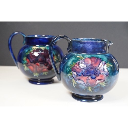 65 - Collection of Moorcroft ceramics to include 2 x Anemone jugs on blue ground (One William Moorcroft e... 
