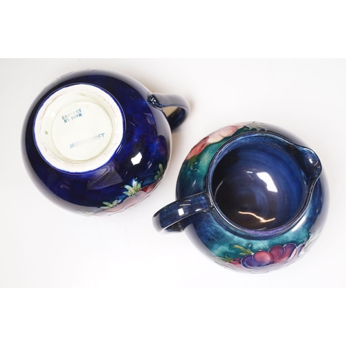 65 - Collection of Moorcroft ceramics to include 2 x Anemone jugs on blue ground (One William Moorcroft e... 