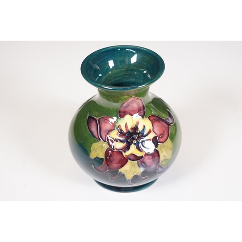 65 - Collection of Moorcroft ceramics to include 2 x Anemone jugs on blue ground (One William Moorcroft e... 