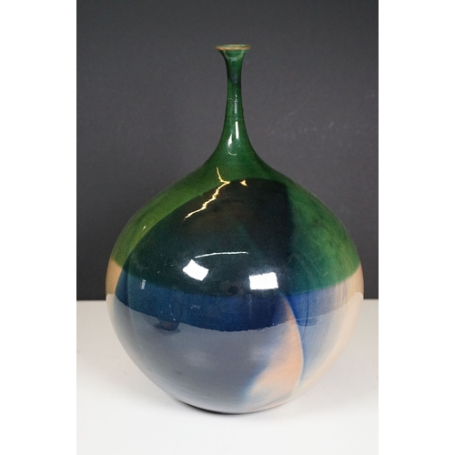 66 - 20th century European narrow neck bud vase of bulbous proportions, with green, blue and terracotta t... 