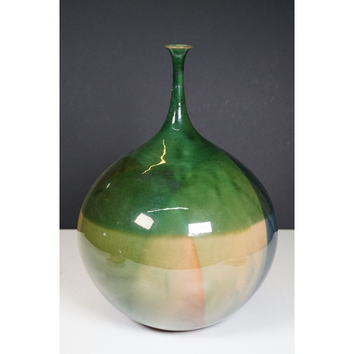 66 - 20th century European narrow neck bud vase of bulbous proportions, with green, blue and terracotta t... 