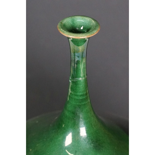 66 - 20th century European narrow neck bud vase of bulbous proportions, with green, blue and terracotta t... 