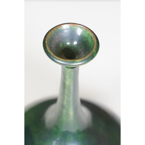66 - 20th century European narrow neck bud vase of bulbous proportions, with green, blue and terracotta t... 