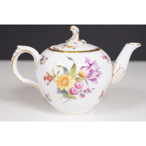 68 - Minton hand-painted cup and saucer decorated with butterflies, moths and foliage, the handle modelle... 