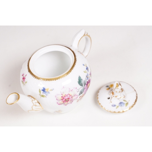 68 - Minton hand-painted cup and saucer decorated with butterflies, moths and foliage, the handle modelle... 