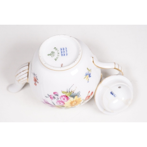 68 - Minton hand-painted cup and saucer decorated with butterflies, moths and foliage, the handle modelle... 
