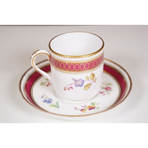 68 - Minton hand-painted cup and saucer decorated with butterflies, moths and foliage, the handle modelle... 