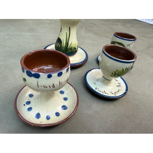 DEVON WARE , 3 EGG CUPS AND A HAT PIN STAND