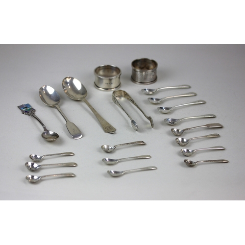 106 - Assorted silver cruet spoons two napkin rings, three teaspoons and a pair of sugar tongs, 7.2oz