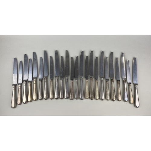 113 - A set of twelve George VI silver handled table knives with steel blades and beaded handles, maker A ... 