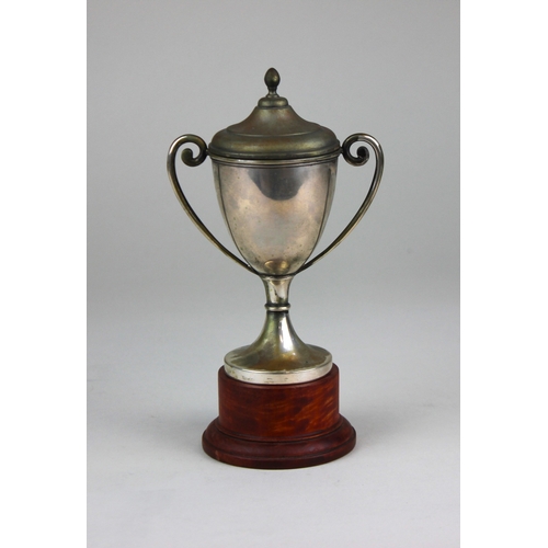 133 - An 800 silver twin handled trophy 4.7oz, on wooden base