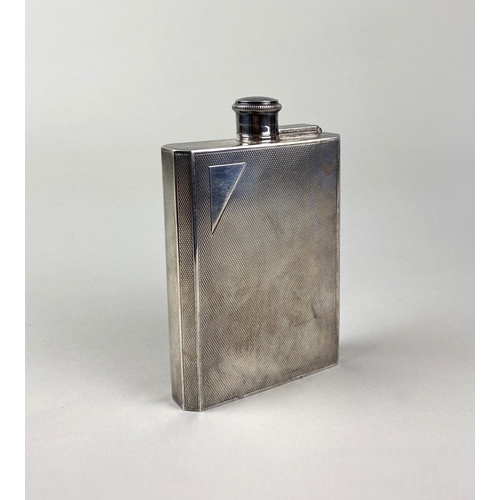 134 - A silver hip flask, with swivel and hinged lid, engine turned decoration, 13.5cm high, hallmarks rub... 