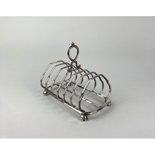 143 - A Victorian silver seven bar toast rack by Harrison Brothers & Howson (George Howson), with ornate c... 