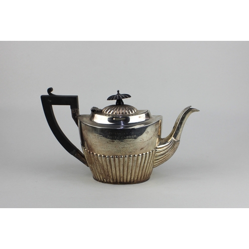 194 - An Edwardian silver teapot demi-reeded oval shape, with presentation inscription, Chester 1902, mark... 