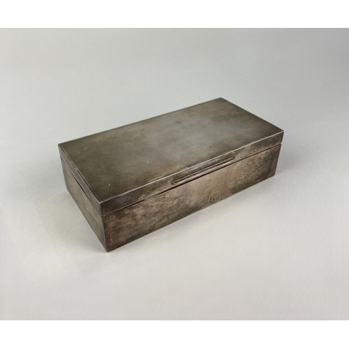 20 - A silver cigarette box, with engine turned decoration, hinged lid, wood lined interior, V Brittain &... 