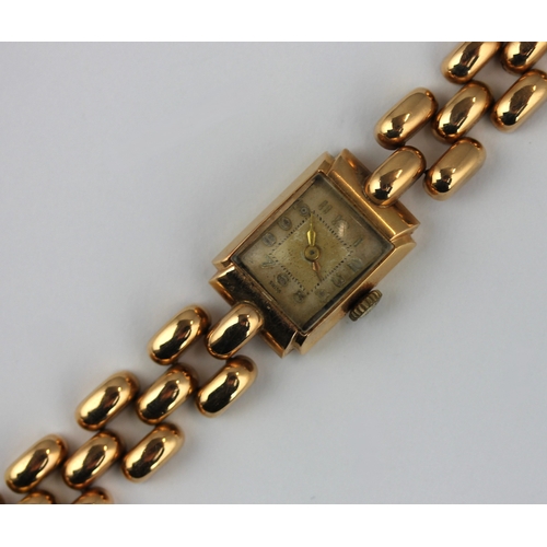 212 - A gold rectangular cased ladies bracelet wristwatch the case back detailed '18k 0,750', the strap un... 