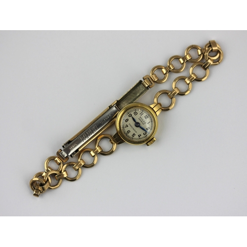 218 - A Rolex Precision gold circular cased ladys wristwatch fitted to an associated gilt bracelet gross ... 