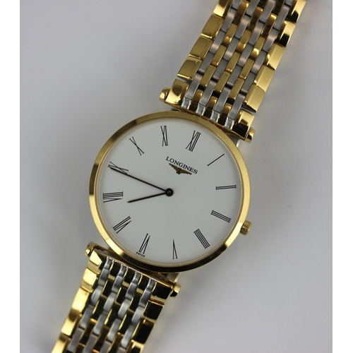 243 - A Longines steel and gilt metal gentleman's bracelet wristwatch, the signed white dial with black Ro... 