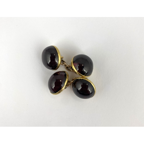 263 - A pair of gold and carbuncle garnet cufflinks as converted from dress buttons 12.1g