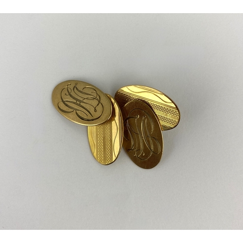 267 - A pair of 9ct gold cufflinks, monogram engraved and engine turned tothe oval backs and fronts, Birmi... 