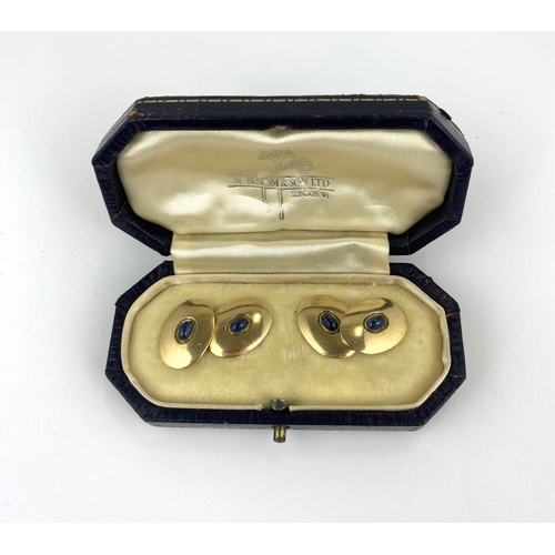 269 - A pair of 9ct gold and cabochon sapphire cufflinks, the oval backs and fronts with oval cabochon sap... 