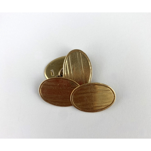 270 - A pair of 9ct gold cufflinks, the oval backs and fronts with banded decoration, Birmingham 1919, com... 