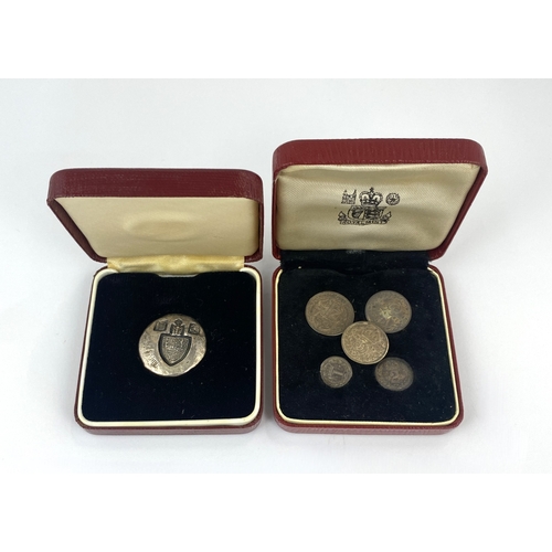 279 - A silver medallion detailed 'The Queens Award to Industry Won in 1973 by The Royal Mint', 20.6g with... 