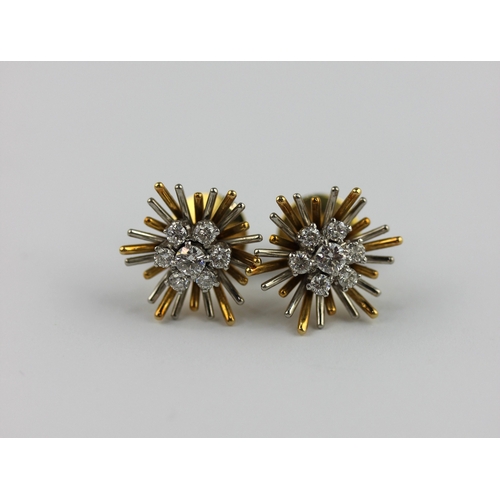 298 - A pair of 18ct two coloured gold and diamond hexagonal form starburst cluster ear studs each claw se... 