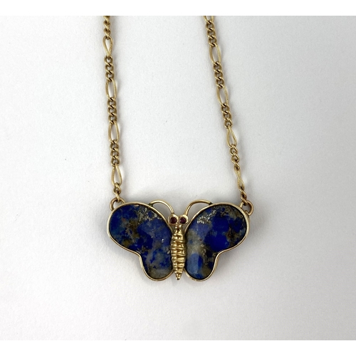 307 - A gold and lapis lazuli pendant necklace designed as a butterfly on a gold figaro link neck chain wi... 