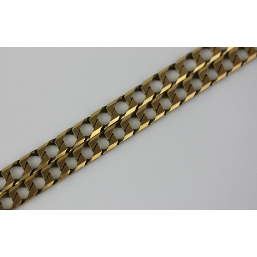 344 - A 9ct gold faceted curb link neck chain with a sprung hook shaped clasp and a matching bracelet comb... 