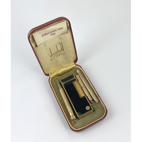 346 - A 9ct gold propelling toothpick (no longer propels), Birmingham 1965, a Dunhill gilt metal and black... 