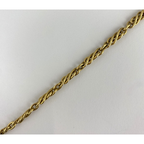 349 - A gold dress Albert chain in a twisted bar and oval link design, fitted with two bolt ring clasps, 1... 