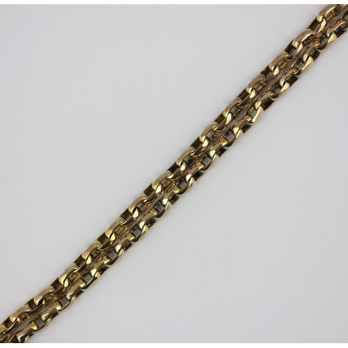 353 - A gold oval link long guard chain, fitted with a swivel detailed '9c', 31.4g