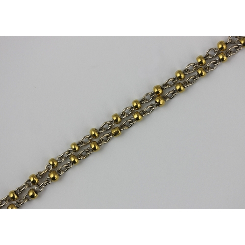 354 - A two-colour gold oval and bead link long guard chain, 157cm long, 57.9g