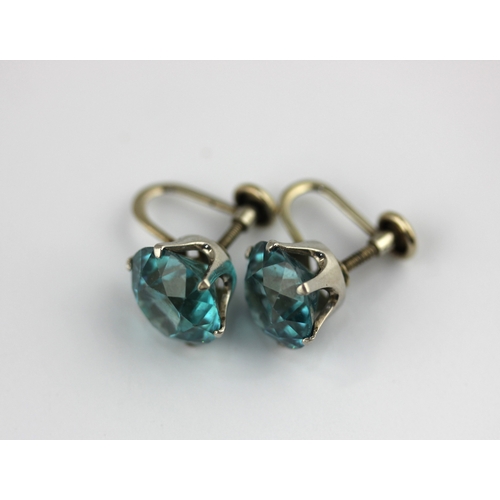 360 - A pair of white gold mounted blue zircon single stone earrings each claw set with a circular cut blu... 