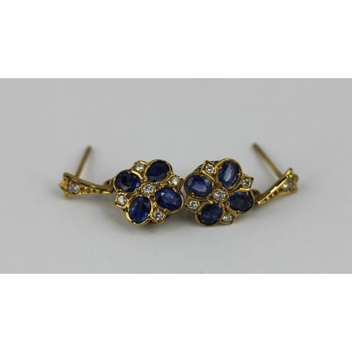 361 - A pair of 9ct gold sapphire and diamond cluster earrings each mounted with four oval cut sapphires a... 