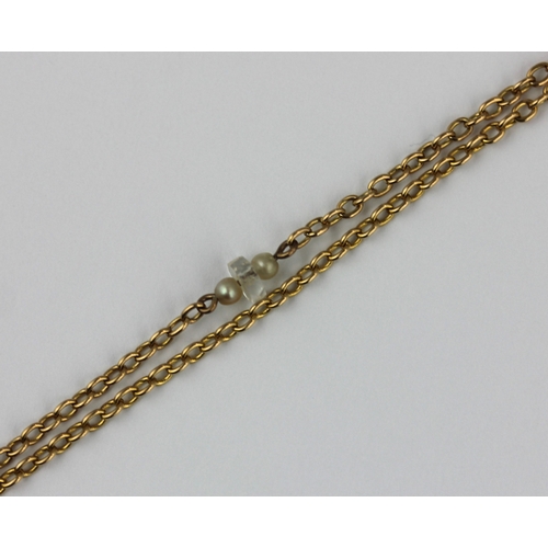 370 - A gold oval link long guard chain fitted with pairs of seed pearls and faceted glass divisions at in... 