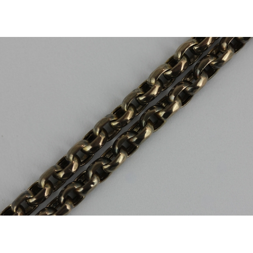 374 - A Victorian faceted oval link long guard chain fitted with a swivel detailed 'B&A'