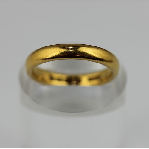 497 - A 22ct gold plain wedding ring, London 1956, ring size O, 6.2g