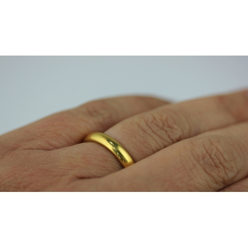 497 - A 22ct gold plain wedding ring, London 1956, ring size O, 6.2g