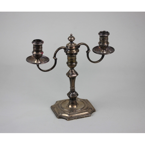 5 - A modern silver candlestick with two detachable scroll branches and centre finial on knopped baluste... 