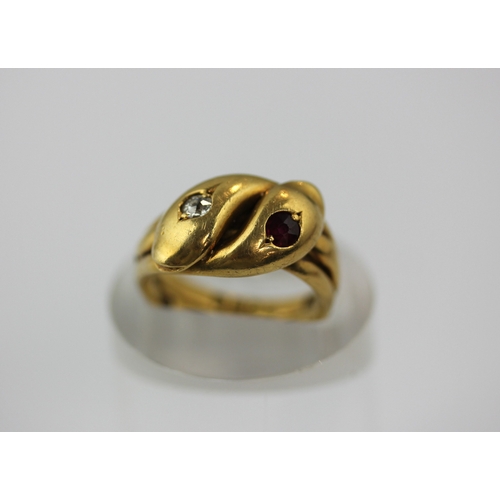 500 - An 18ct gold diamond and ruby ring designed as two entwined snakes mounted with a cushion shaped dia... 