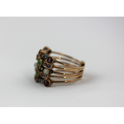 504 - A gold and silver set ruby demantoid garnet, sapphire, rose diamond and imitation pearl ring in a fi... 