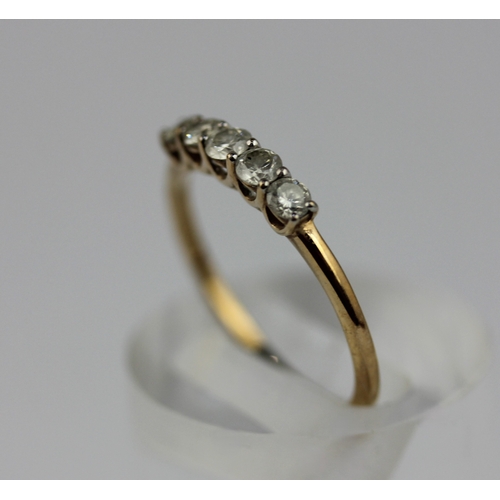 506 - A 9ct gold and diamond five stone ring claw set with a row of circular cut diamonds detailed '9k', r... 