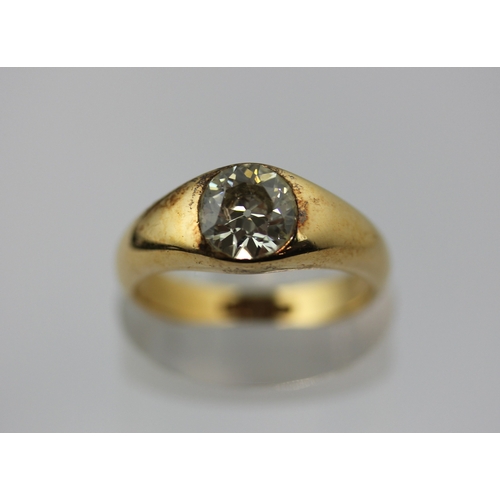 511 - A gold and diamond single stone ring, gypsy set with a cushion shaped diamond, detailed '18ct', ring... 