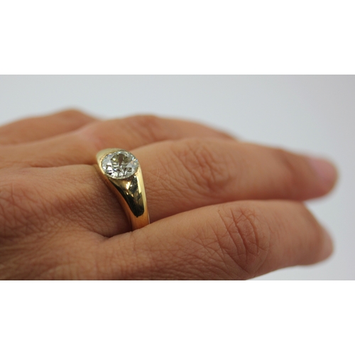 511 - A gold and diamond single stone ring, gypsy set with a cushion shaped diamond, detailed '18ct', ring... 