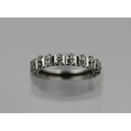 513 - A diamond full eternity ring mounted with pairs of circular cut diamonds, ring size P/Q, gross weigh... 