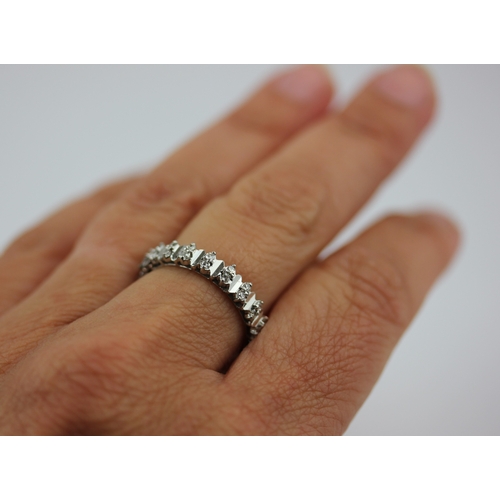 513 - A diamond full eternity ring mounted with pairs of circular cut diamonds, ring size P/Q, gross weigh... 