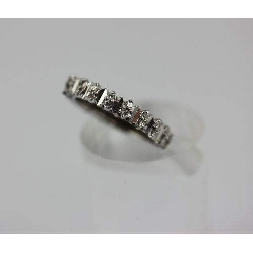 513 - A diamond full eternity ring mounted with pairs of circular cut diamonds, ring size P/Q, gross weigh... 